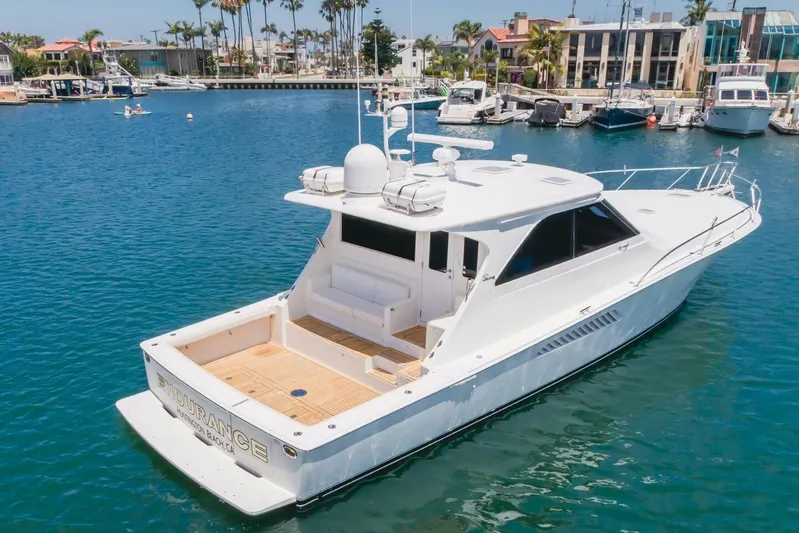Endurance Yacht Photos Pics 2008 Viking 52 Sport Coupe yacht docked in a marina, surrounded by other boats.