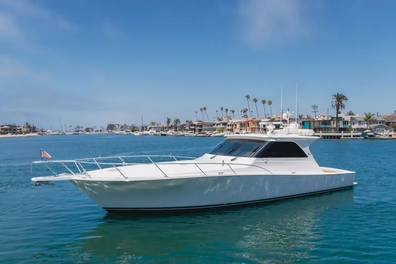 Endurance Yacht Photos Pics 2008 Viking 52 Sport Coupe yacht cruising in a scenic coastal area.