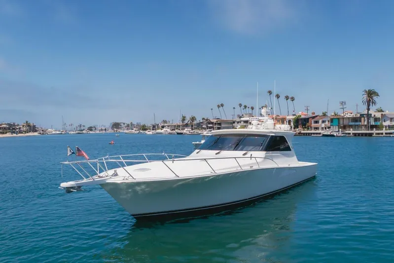 Endurance Yacht Photos Pics 2008 Viking 52 Sport Coupe yacht cruising in a scenic coastal harbor.