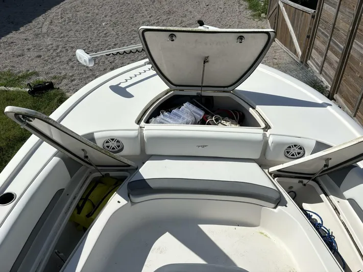  Yacht Photos Pics 2019 Tidewater 2700 Carolina Bay boat with open storage compartments and seating area.