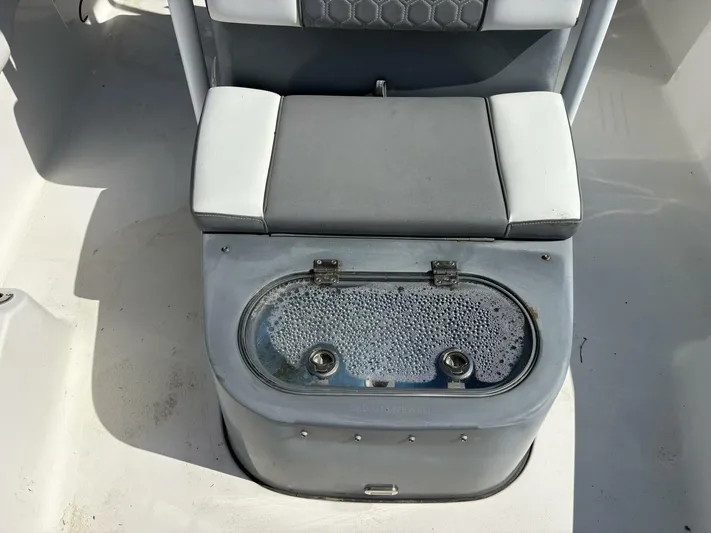  Yacht Photos Pics Livewell on 2019 Tidewater 2700 Carolina Bay boat, featuring cushioned seating.