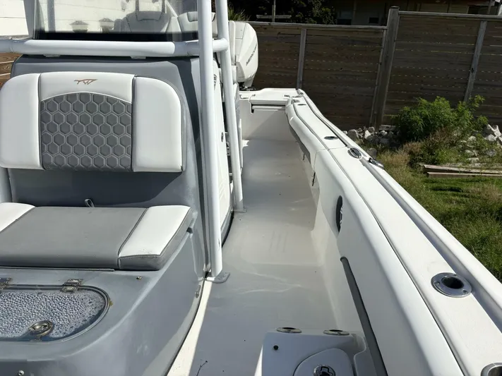  Yacht Photos Pics 2019 Tidewater 2700 Carolina Bay boat interior with seating and storage compartments.