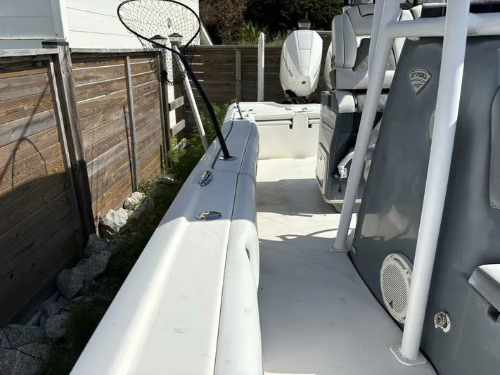  Yacht Photos Pics 2019 Tidewater 2700 Carolina Bay boat interior with fishing net and seating.