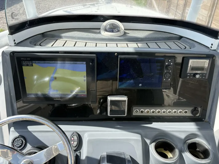  Yacht Photos Pics 2019 Tidewater 2700 Carolina Bay boat dashboard with navigation and control systems.