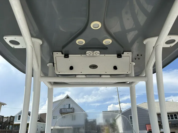  Yacht Photos Pics 2019 Tidewater 2700 Carolina Bay boat T-top with electronics, against a clear sky background.