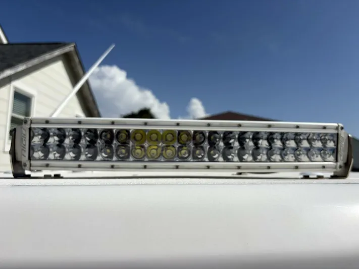  Yacht Photos Pics LED light bar on a 2019 Tidewater 2700 Carolina Bay boat, under a clear blue sky.