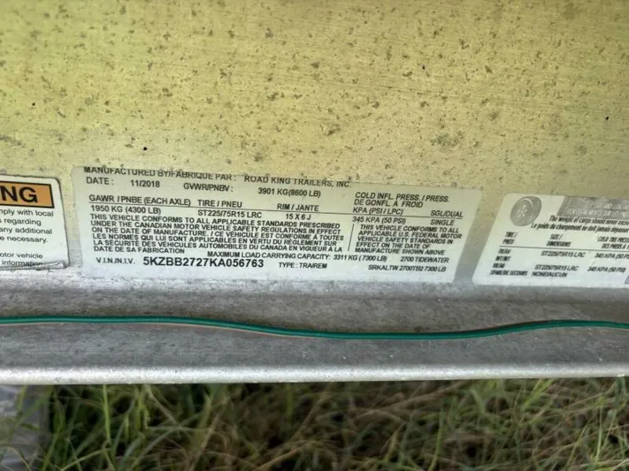  Yacht Photos Pics Label on a 2019 Tidewater 2700 Carolina Bay boat trailer, showing specifications and compliance details.