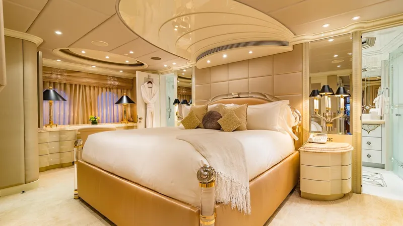 I Love This Boat Yacht Photos Pics Luxurious bedroom on 2002 Christensen Tri Deck yacht with elegant decor and ambient lighting.