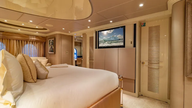 I Love This Boat Yacht Photos Pics Luxurious bedroom interior on 2002 Christensen Tri Deck yacht, featuring elegant decor and modern amenities.
