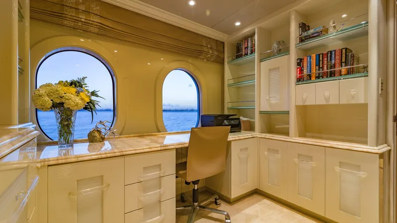 I Love This Boat Yacht Photos Pics Luxurious yacht office with ocean view, elegant desk, bookshelves, and floral arrangement. Christensen Tri Deck 2002.