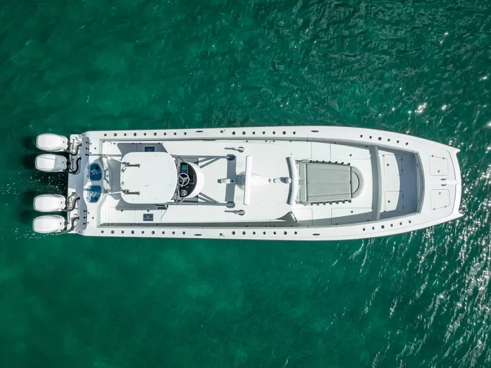 "whiskey Business" Yacht Photos Pics Aerial view of 2020 Freeman 42 LR boat on clear turquoise water.