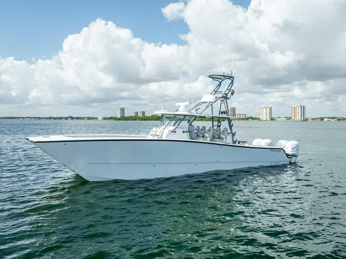 "whiskey Business" Yacht Photos Pics 2020 Freeman 42 LR boat on calm water with city skyline in background.