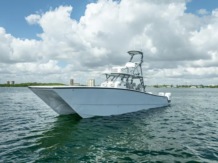 "whiskey Business" Yacht Photos Pics 2020 Freeman 42 LR boat on open water under cloudy sky.
