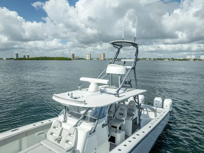 "whiskey Business" Yacht Photos Pics 2020 Freeman 42 LR boat on calm water under cloudy sky.
