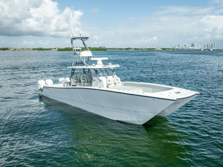 "whiskey Business" Yacht Photos Pics 2020 Freeman 42 LR boat on calm water with city skyline in background.
