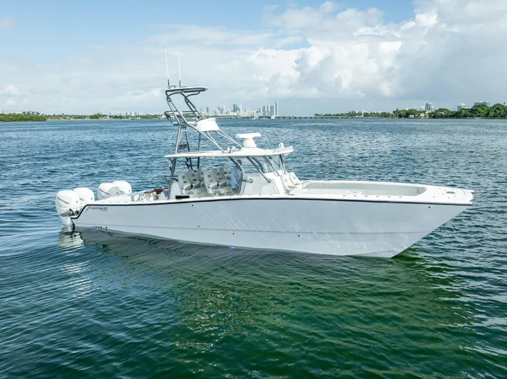 "whiskey Business" Yacht Photos Pics 2020 Freeman 42 LR boat on calm water, clear sky background.