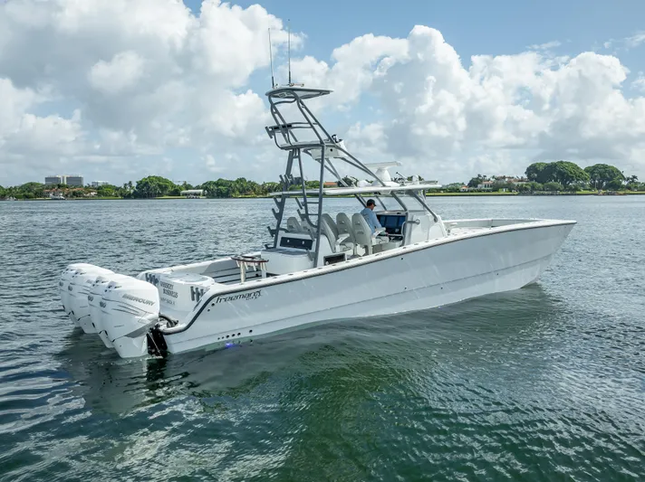 "whiskey Business" Yacht Photos Pics 2020 Freeman 42 LR boat on calm water under cloudy sky.