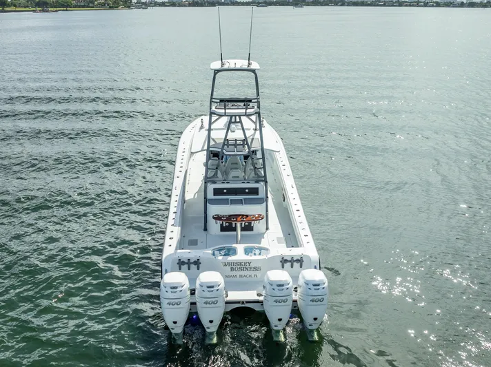 "whiskey Business" Yacht Photos Pics 2020 Freeman 42 LR boat with quad engines on calm water.