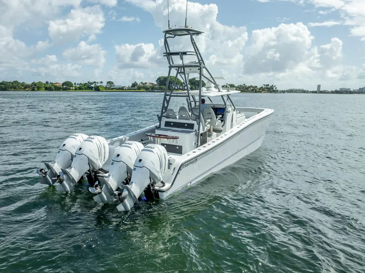 "whiskey Business" Yacht Photos Pics 2020 Freeman 42 LR boat with multiple outboard engines on open water.