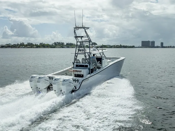 "whiskey Business" Yacht Photos Pics Freeman 42 LR 2020 boat cruising on open water with triple engines.