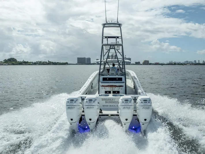 "whiskey Business" Yacht Photos Pics 2020 Freeman 42 LR boat with quad engines cruising on open water.