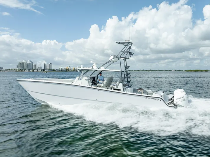 "whiskey Business" Yacht Photos Pics Freeman 42 LR 2020 boat cruising on open water under a cloudy sky.