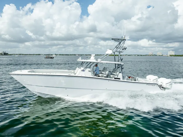 "whiskey Business" Yacht Photos Pics Freeman 42 LR 2020 boat cruising on open water under cloudy sky.