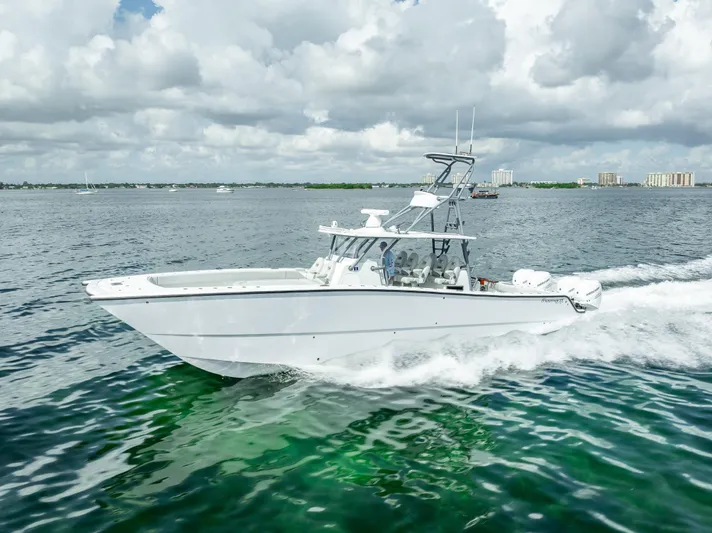 "whiskey Business" Yacht Photos Pics 2020 Freeman 42 LR boat cruising on open water under cloudy skies.