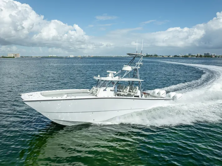 "whiskey Business" Yacht Photos Pics 2020 Freeman 42 LR boat cruising on open water under a clear sky.