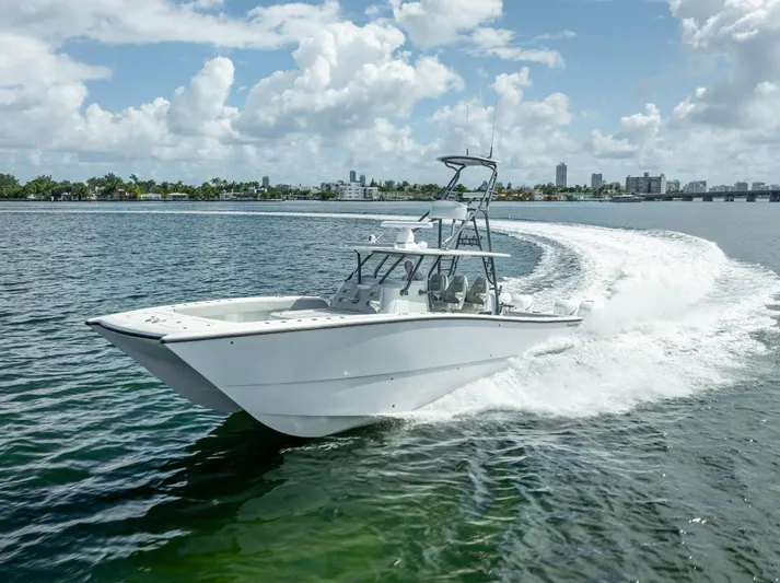 "whiskey Business" Yacht Photos Pics Freeman 42 LR 2020 boat cruising on open water under a clear sky.