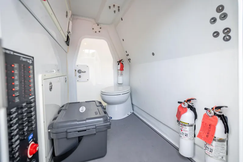 "whiskey Business" Yacht Photos Pics Interior of a 2020 Freeman 42 LR boat with safety equipment and storage.