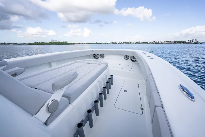 "whiskey Business" Yacht Photos Pics Freeman 42 LR 2020 boat interior with seating, rod holders, and ocean view.