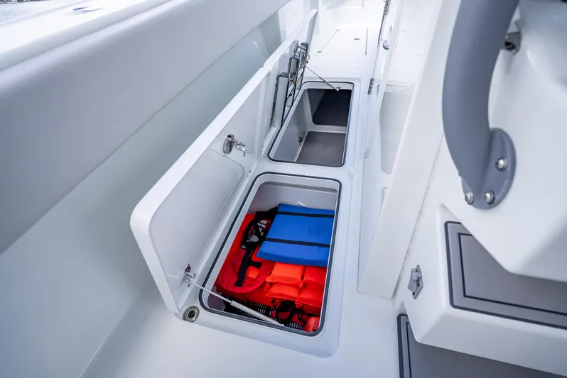 "whiskey Business" Yacht Photos Pics Freeman 42 LR 2020 boat storage compartments with life jackets and gear.