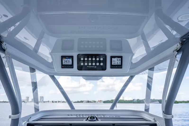 "whiskey Business" Yacht Photos Pics Freeman 42 LR 2020 boat dashboard with digital displays and controls, overlooking water.