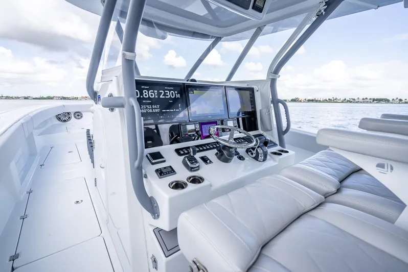 "whiskey Business" Yacht Photos Pics 2020 Freeman 42 LR boat cockpit with advanced navigation system and luxurious seating.