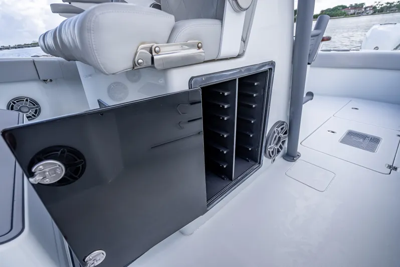 "whiskey Business" Yacht Photos Pics 2020 Freeman 42 LR boat interior with open storage compartment and seating.