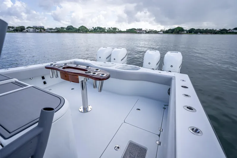 "whiskey Business" Yacht Photos Pics Freeman 42 LR 2020 boat deck with multiple outboard engines on a calm lake.