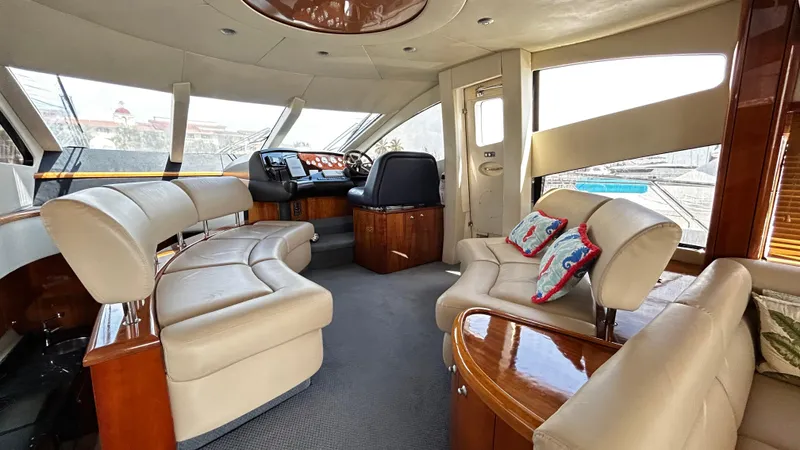 2006 Sunseeker Manhattan 60 @ Cancun Yacht Photos Pics Luxurious interior of 2006 Sunseeker Manhattan 60 yacht with plush seating and elegant design.