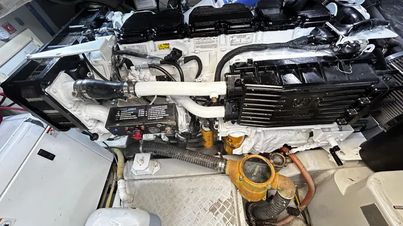 2006 Sunseeker Manhattan 60 @ Cancun Yacht Photos Pics Engine compartment of a 2006 Sunseeker Manhattan 60 yacht, showcasing mechanical components.