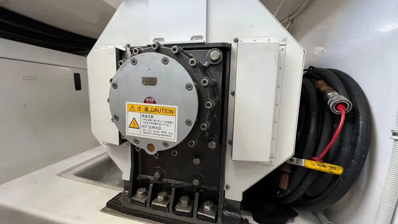 Saietta Yacht Photos Pics Engine component of a 2010 Bertram Convertible boat with caution label.