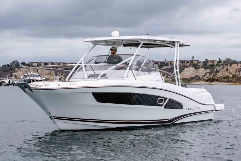  Yacht Photos Pics 2023 Jeanneau Leader 9.0 WA boat on water, sleek design, overcast sky.