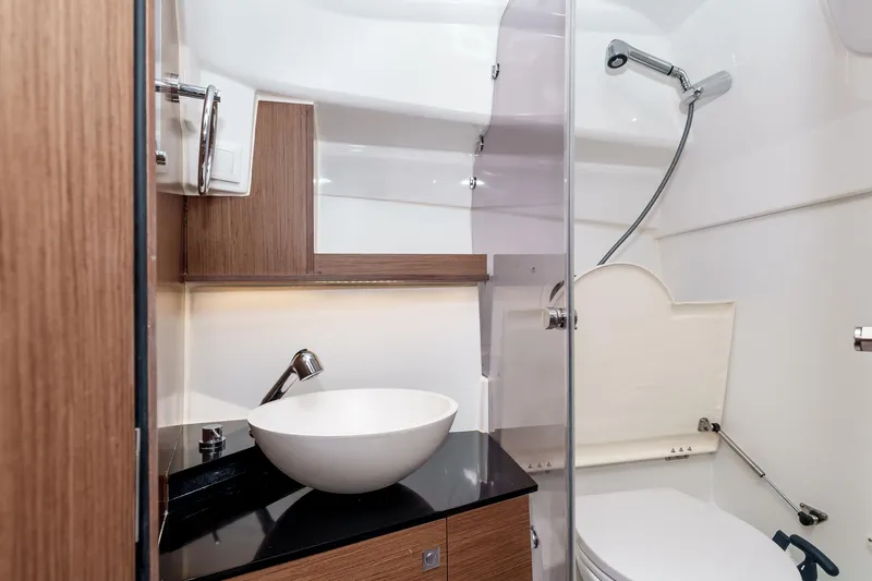  Yacht Photos Pics Modern bathroom interior of 2023 Jeanneau Leader 9.0 WA boat, featuring sleek design elements.