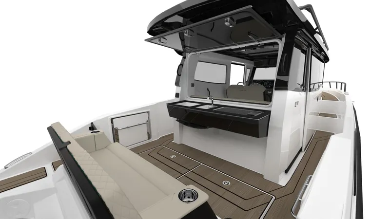  Yacht Photos Pics 2025 Navan C30 boat interior with sleek design, featuring seating and a compact kitchenette.