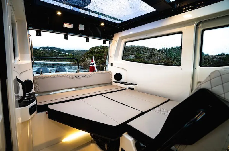  Yacht Photos Pics Interior of 2025 Navan C30 boat with modern seating and scenic window view.