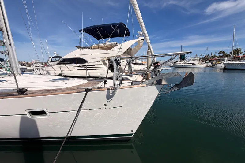 Tadpole Yacht Photos Pics 2005 Beneteau Oceanis Clipper 423 yacht docked in a marina under a clear blue sky.