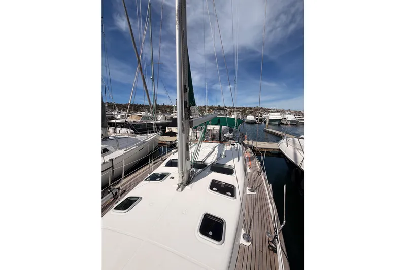 Tadpole Yacht Photos Pics 2005 Beneteau Oceanis Clipper 423 sailboat docked at marina under blue sky.