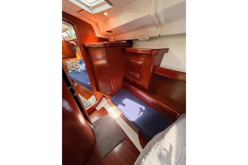 Tadpole Yacht Photos Pics Interior of 2005 Beneteau Oceanis Clipper 423 with polished wood and cozy seating.