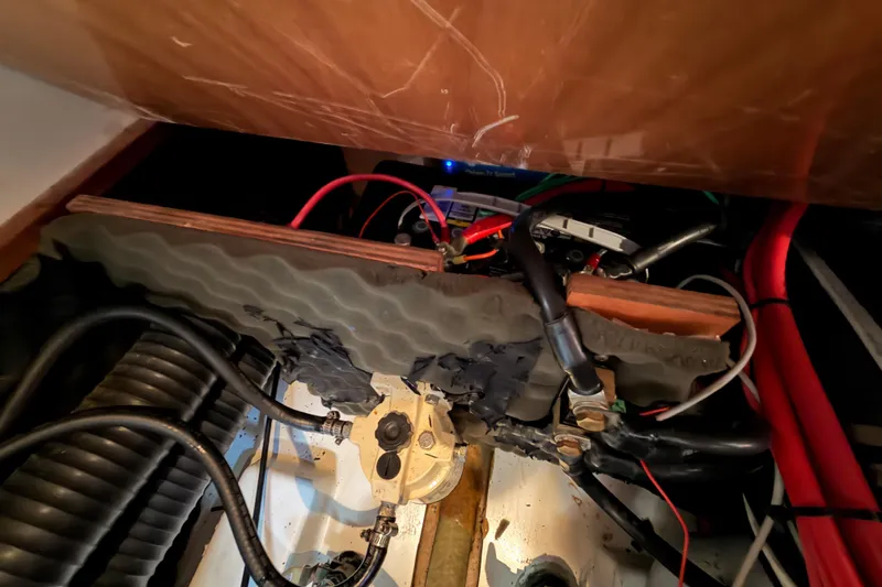 Tadpole Yacht Photos Pics Engine compartment of 2005 Beneteau Oceanis Clipper 423 with visible wiring and components.