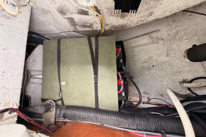 Tadpole Yacht Photos Pics Battery compartment of a 2005 Beneteau Oceanis Clipper 423 sailboat, showing wiring and components.