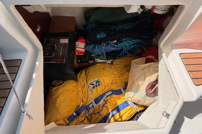 Tadpole Yacht Photos Pics Storage compartment of a 2005 Beneteau Oceanis Clipper 423 with sailing gear and ropes.